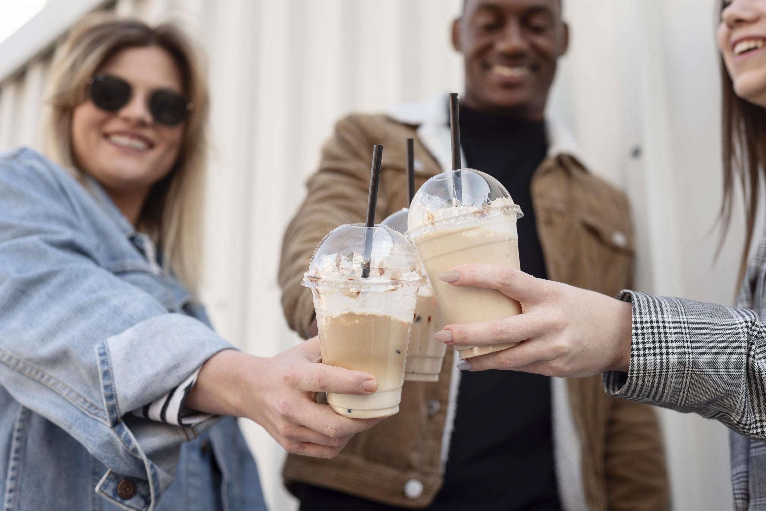 friends-hanging-out-while-enjoying-cup-coffee
